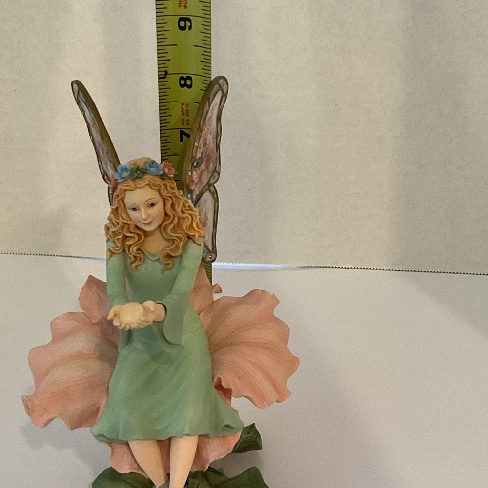 Whimsical Fairy Sculpture with Pink and Green Details